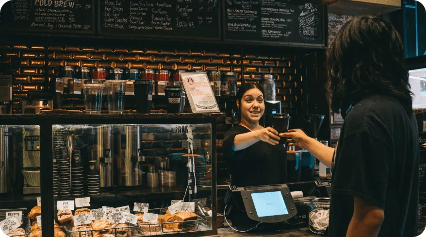Ground Central Coffee Company in Midtown NYC, a library-themed coffee shop with book-lined walls and a cozy, inviting atmosphere.
