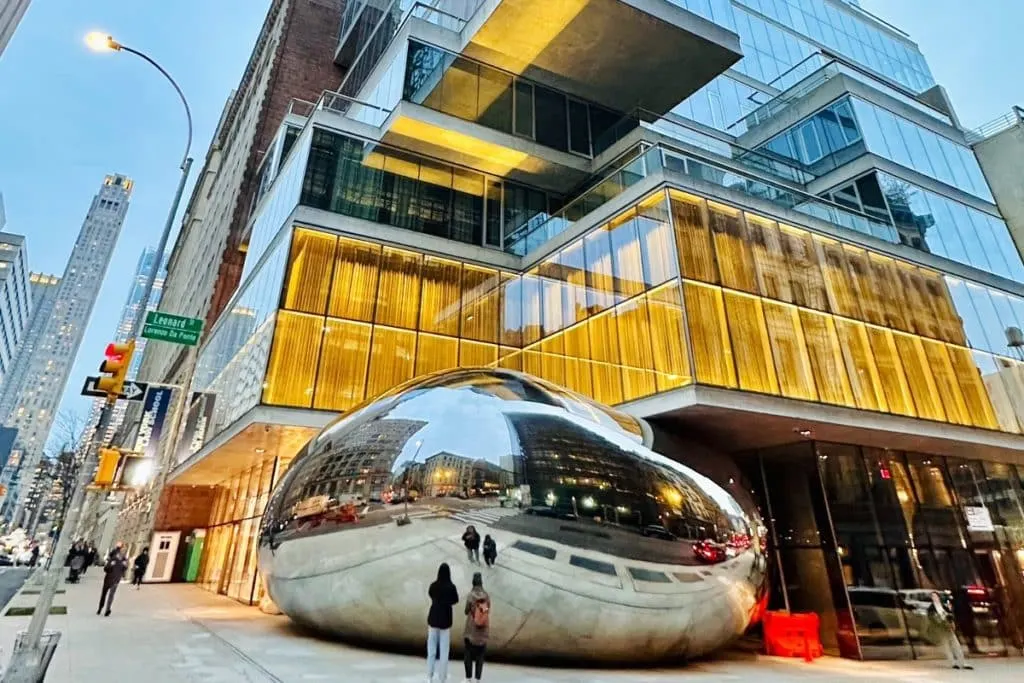 The Bean cafe in New York City, showcasing colorful wall art, relaxed seating, and creative coffee drinks.