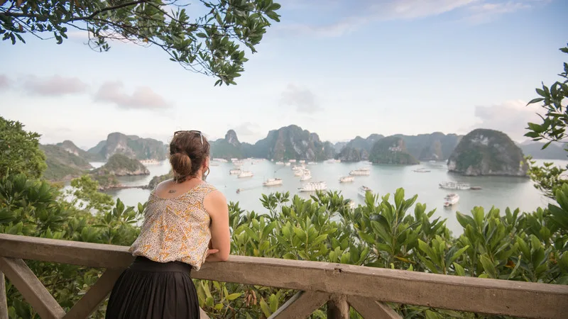 A breathtaking view of a top solo travel destination featuring mountains, beaches, and cityscapes.