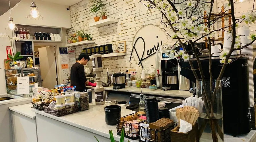 Remi Flower & Coffee shop in Midtown NYC, blending a flower boutique with a coffee bar, featuring floral arrangements and handcrafted drinks.